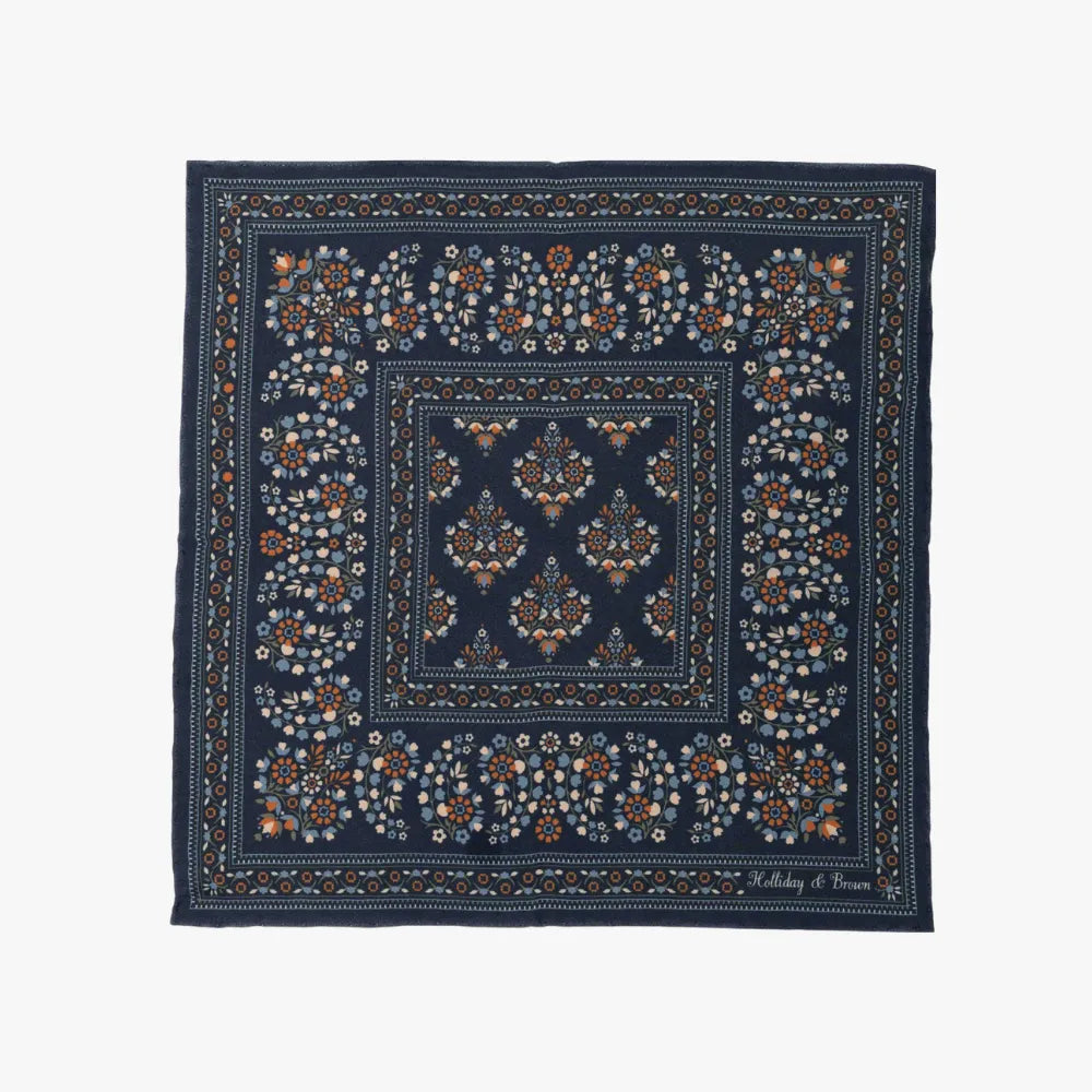 Full view of the Holliday & Brown pocket square in navy, showing the complete printed pattern, rich navy tone, and bordered design.