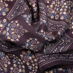 Close-up of the Holliday & Brown pocket square in plum showing the fine weave, drape, and intricate print work.