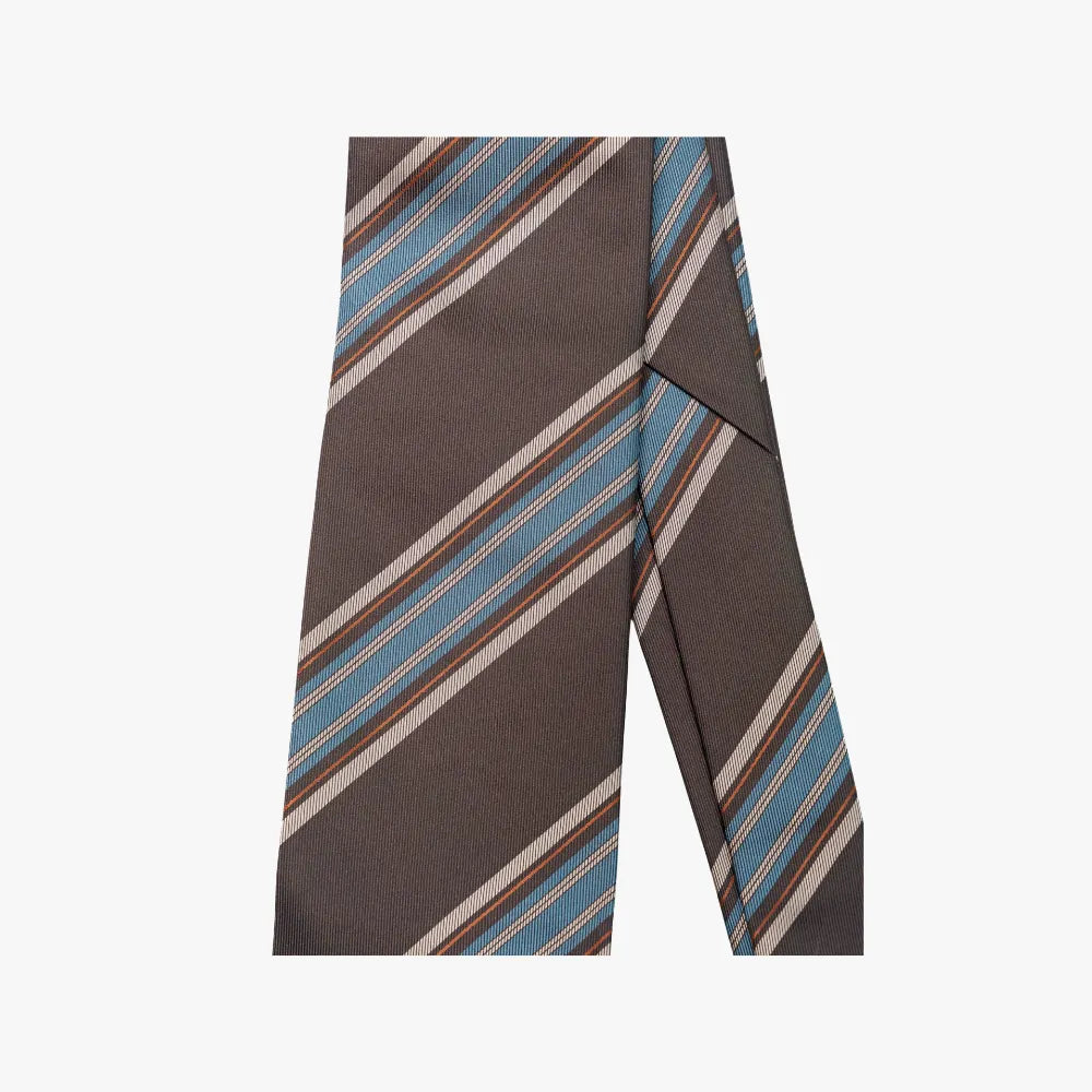 Close-up of the tie blade highlighting the brown and blue stripe pattern, diagonal weave, and refined color balance.