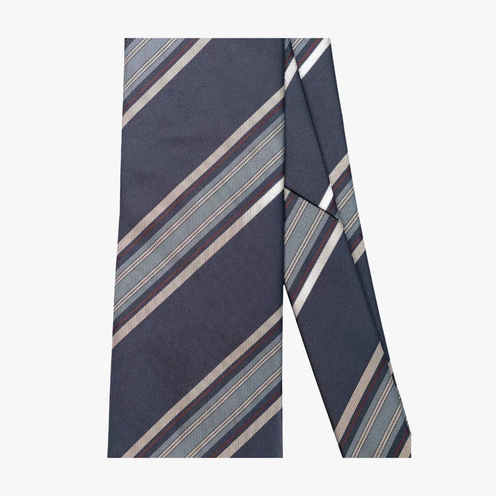 Close-up of the tie blade highlighting the navy and blue stripe pattern, clean diagonal lines, and woven texture.