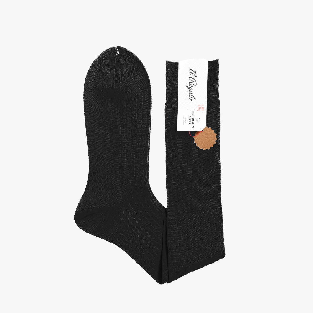 Folded detail view highlighting the rib texture and reinforced toe of the Il Regalo 8x2 Rib Over-The-Calf Socks in Black.