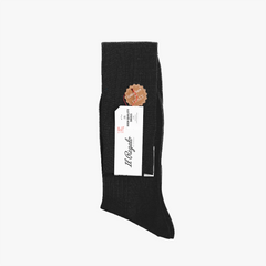 Side profile of the Il Regalo 8x2 Rib Over-The-Calf Socks in Black showcasing rib structure and craftsmanship.