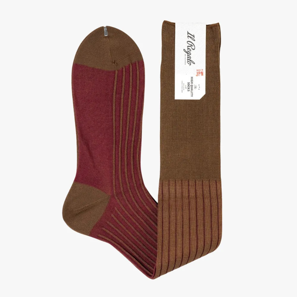 Side view of the Il Regalo Reversible Over The Calf Socks highlighting the rib-knit pattern, contrasting heel and toe, and dual-color reversible design.