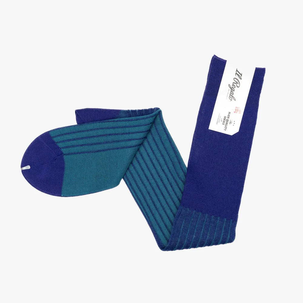 Side view of the Il Regalo Reversible Over The Calf Socks showing the rib knit pattern, contrasting heel and toe, and the reversible two-tone design.