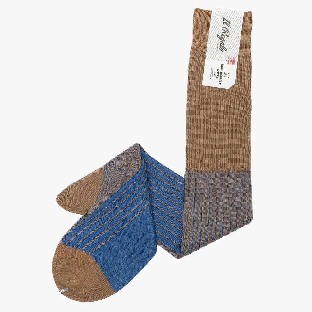 Side view of the Il Regalo Reversible Over The Calf Socks showing the rib knit pattern, contrasting heel and toe, and the reversible two-tone design.