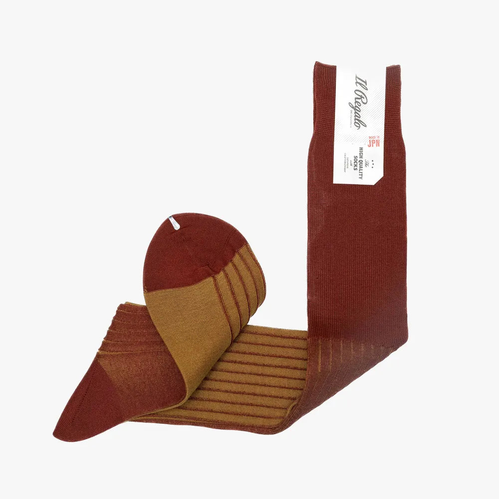 Folded view of the Il Regalo Reversible OT C Socks displaying both Terracotta and Saffron tones and the dual-color reversible construction.
