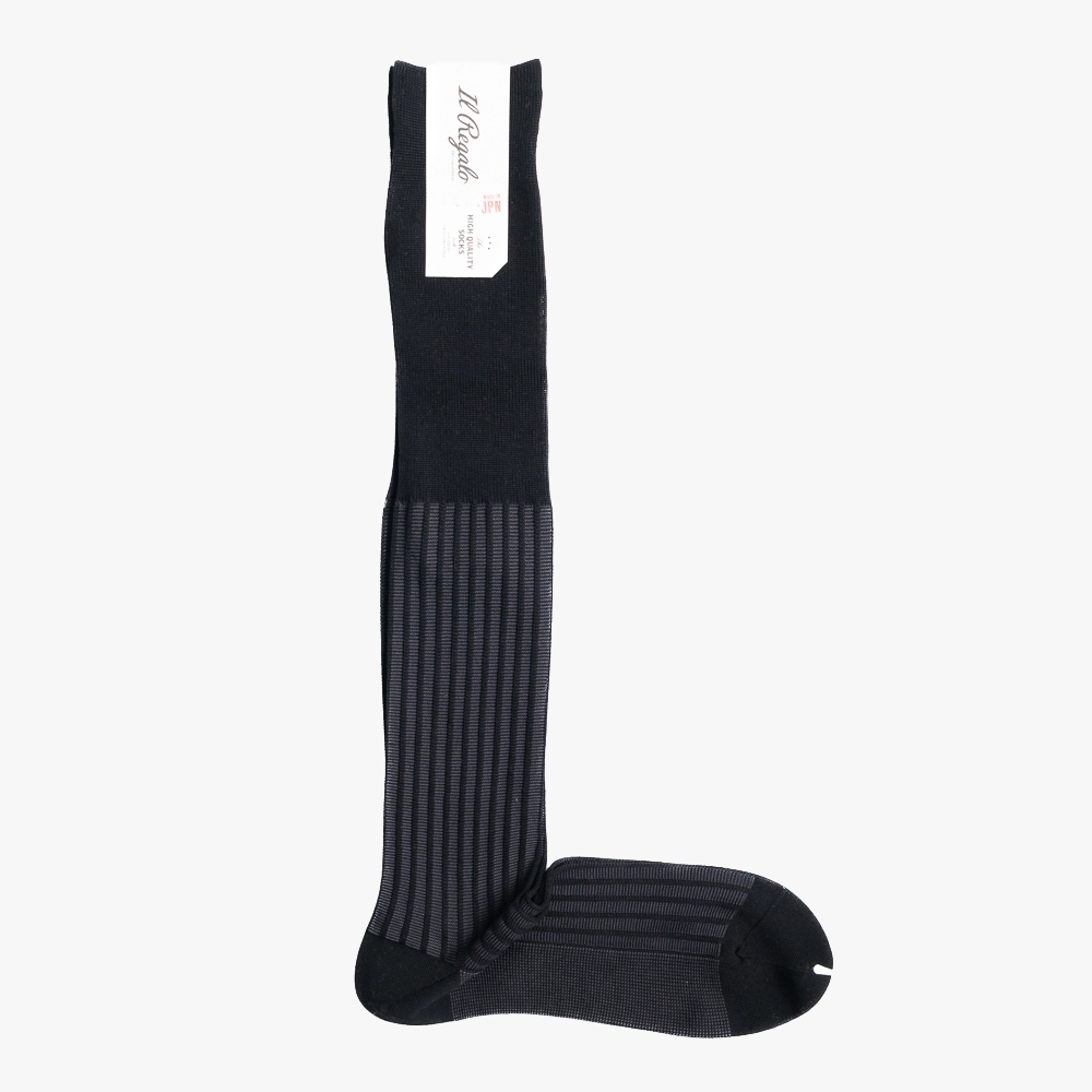 Full view of the Il Regalo Stripe Jacquard Over-The-Calf Socks Black showing the vertical stripe jacquard pattern and long over-the-calf silhouette.