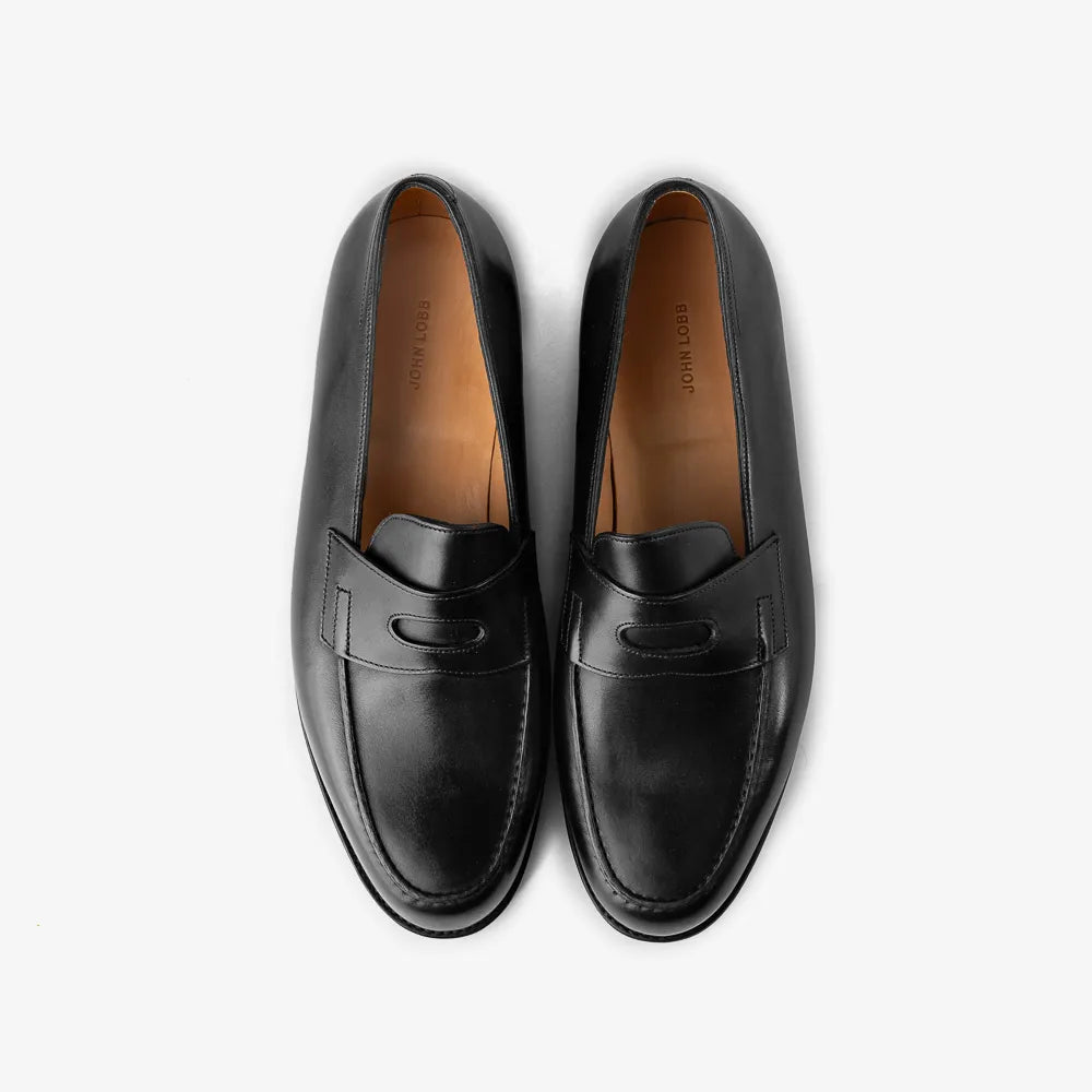 John Lobb Lopez loafer in black calf leather, top view showing strap and apron stitching.