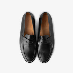 John Lobb Lopez loafer in black calf leather, top view showing strap and apron stitching.