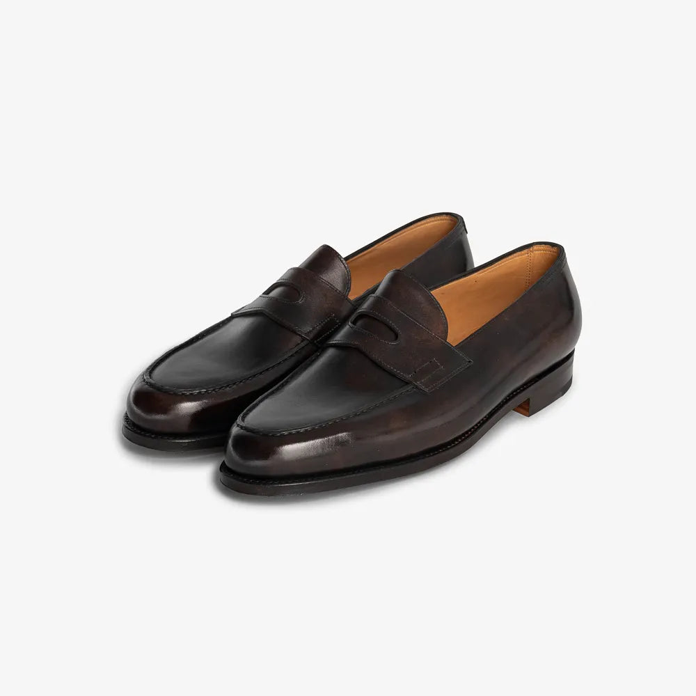 John Lobb Lopez in dark brown Museum Calf leather, angled front view showing penny strap and apron.