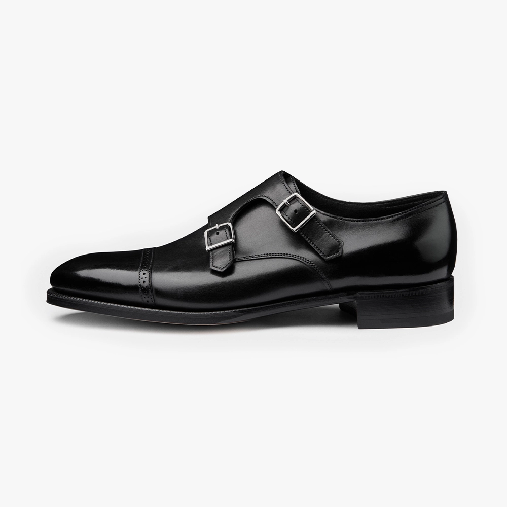 Side view of the John Lobb Philip II in Black highlighting the sleek silhouette, polished buckles, and clean leather finish.