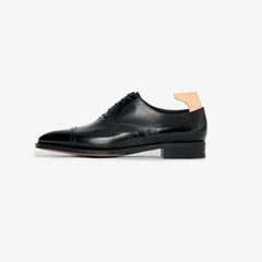 John Lobb Philip II Oxford in black calf leather, side profile highlighting elegant silhouette.