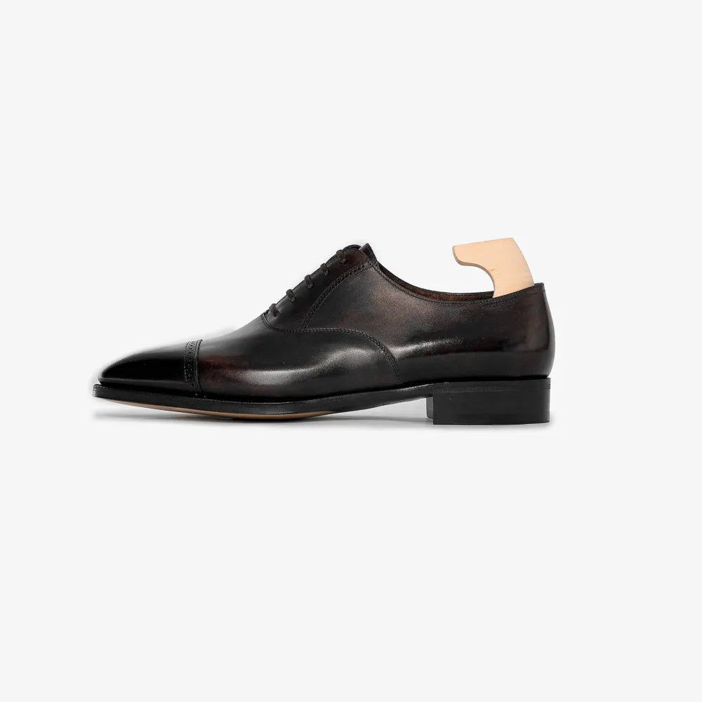 John Lobb Philip II Oxford in black calf leather, side profile showing closed lacing.