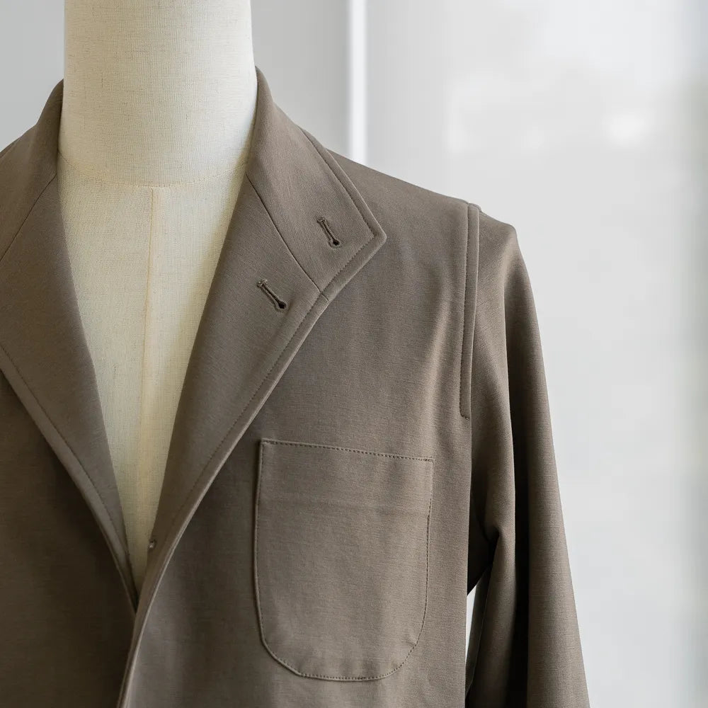 Close-up of the collar and neckline of the Justo Gimeno Teba Jacket Hopsack by VBC Green