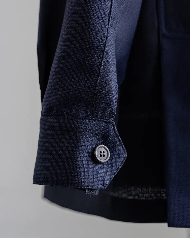Sleeve and button close-up on the Justo Gimeno Teba Jacket Hopsack by VBC Navy