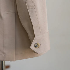 Sleeve and button detail of the Justo Gimeno Teba Jacket Knited Stone