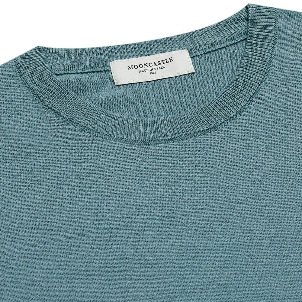 Close-up of the ribbed crew neck collar showing ice cotton knit structure, stitching, and refined finishing.