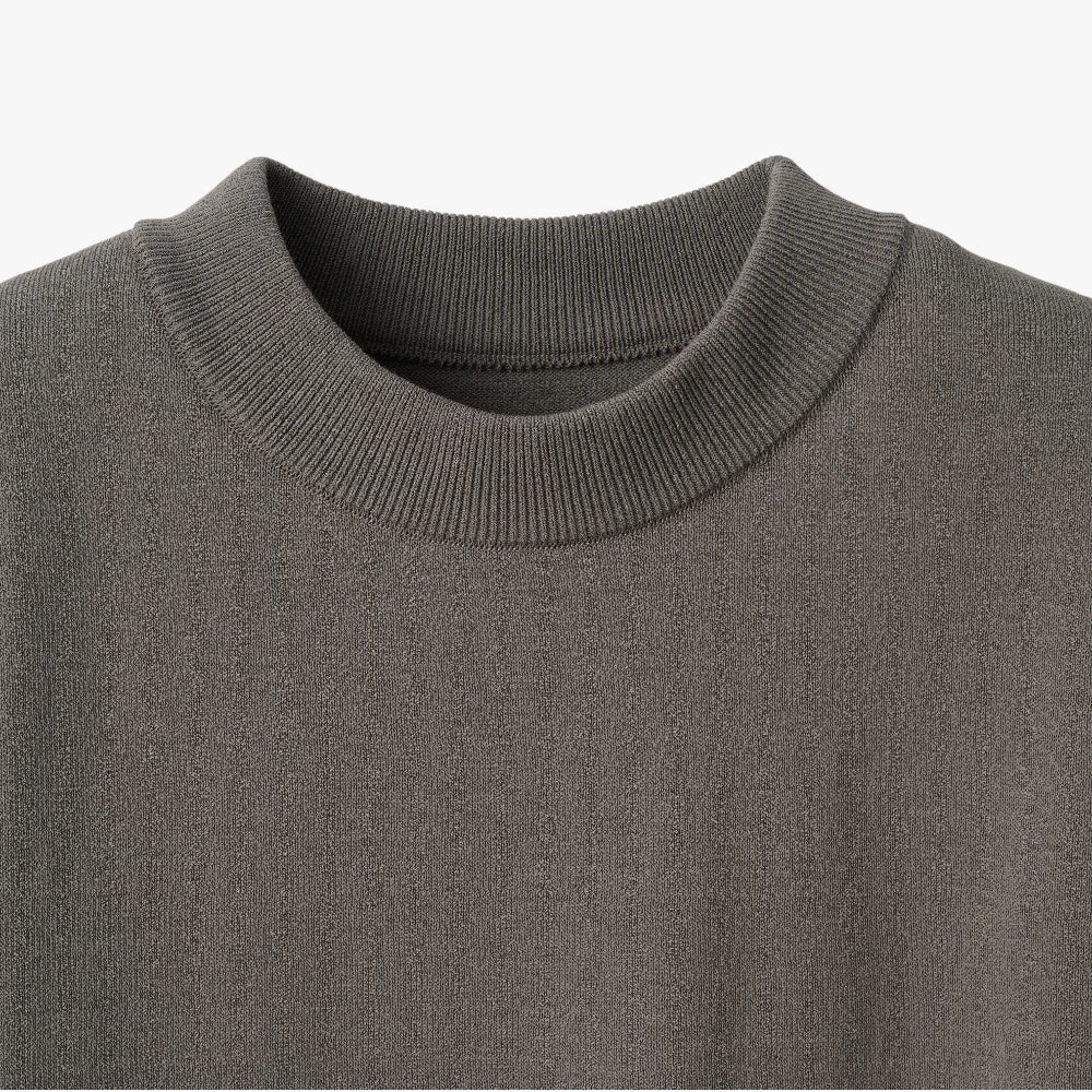 Close-up of the mock neck collar highlighting the structured ribbed knit and smooth finishing.
