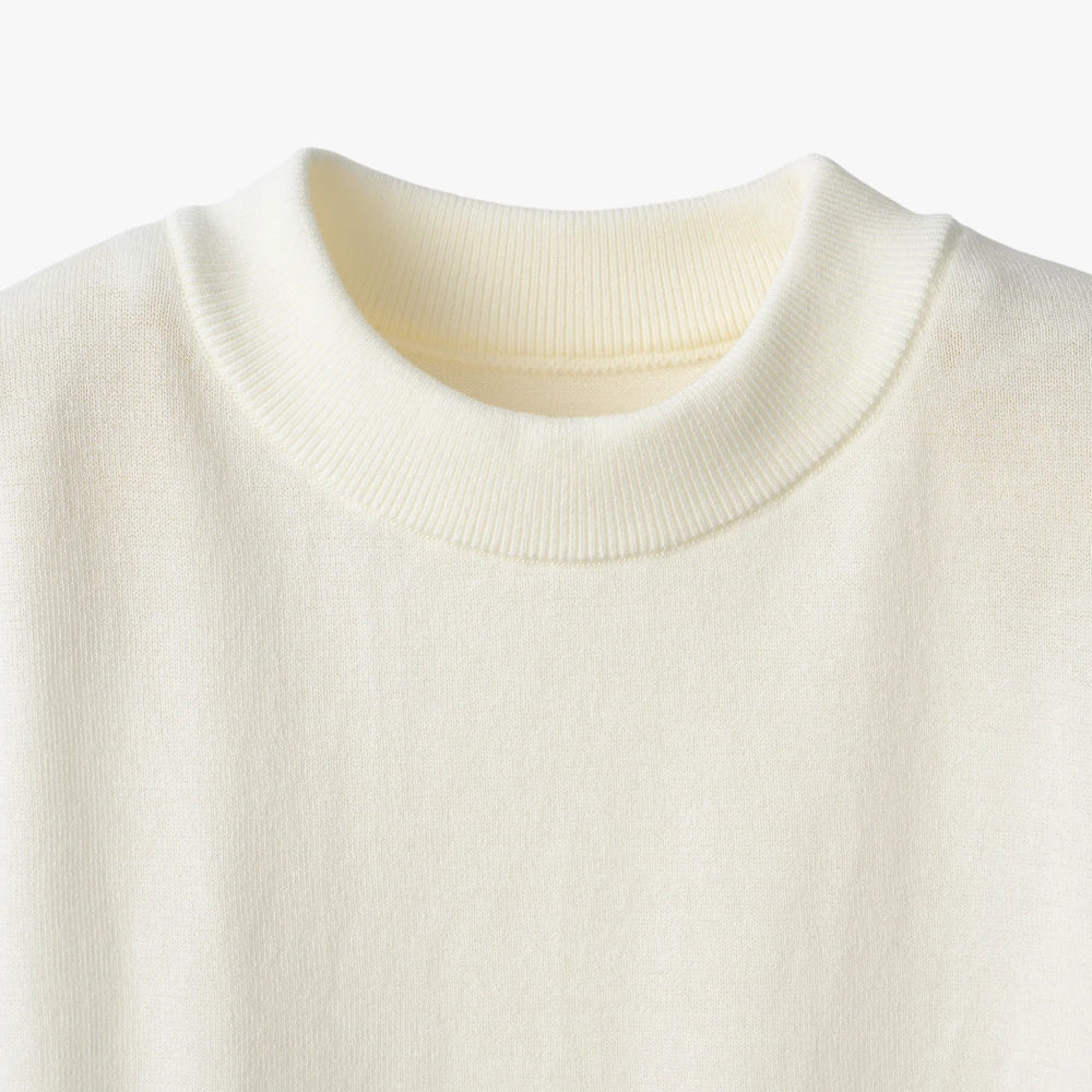 Close-up of the mock neck collar highlighting the structured ribbed knit and smooth finishing.