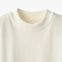 Close-up of the mock neck collar highlighting the structured ribbed knit and smooth finishing.