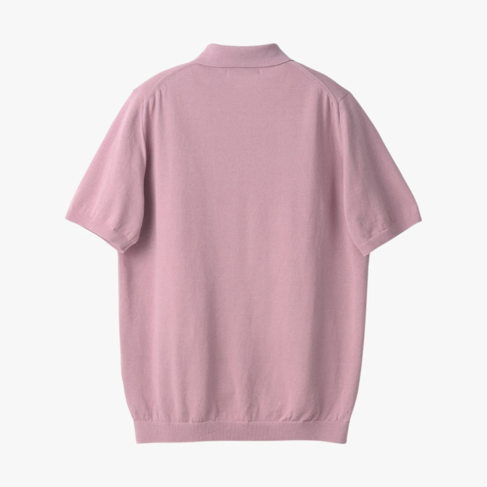 Back view of the Mooncastle Ice Cotton Polo in sakura showing the smooth knit structure and relaxed fit.