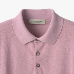 Close-up of the polo collar highlighting the structured knit collar and button placket detail.
