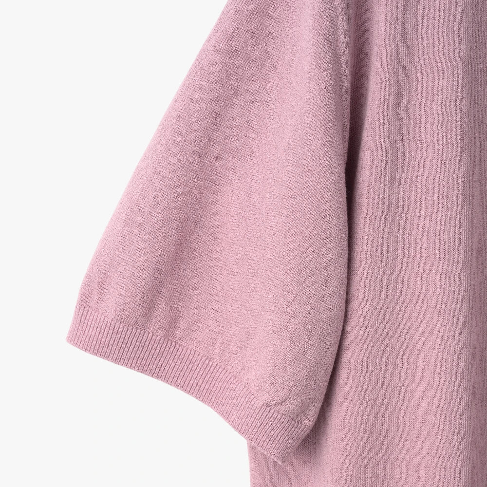 Close-up of the sleeve showing the Ice Cotton knit texture and ribbed cuff finishing.
