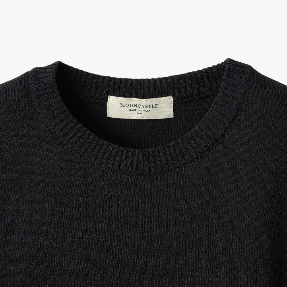 Close-up of the crew neck collar highlighting the ribbed knit construction and clean finishing.
