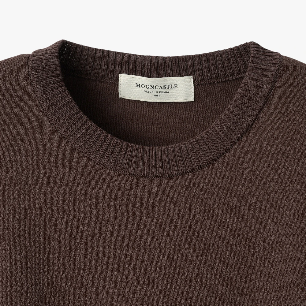 Close-up of the crew neck collar highlighting the ribbed knit construction and clean finishing.