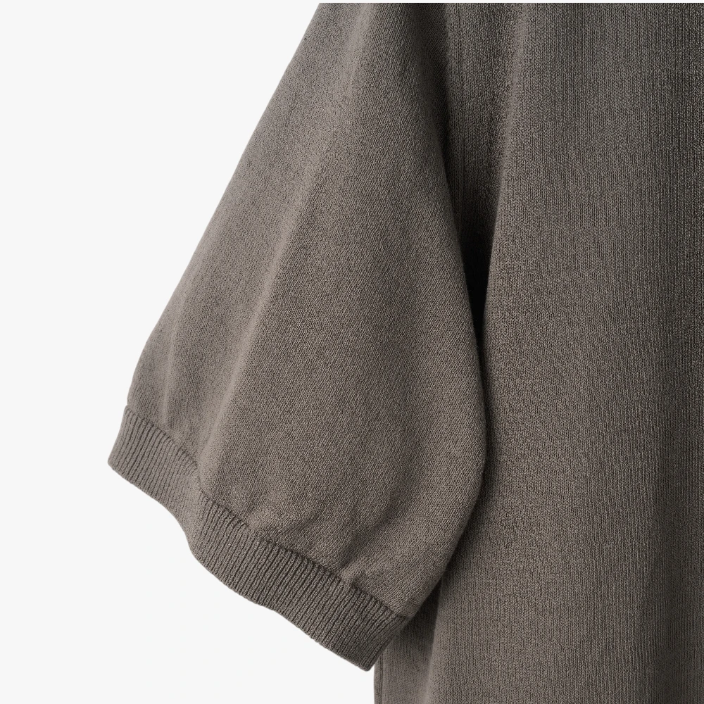 Close-up of the crew neck collar highlighting the ribbed knit construction and clean finishing.