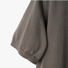 Close-up of the crew neck collar highlighting the ribbed knit construction and clean finishing.