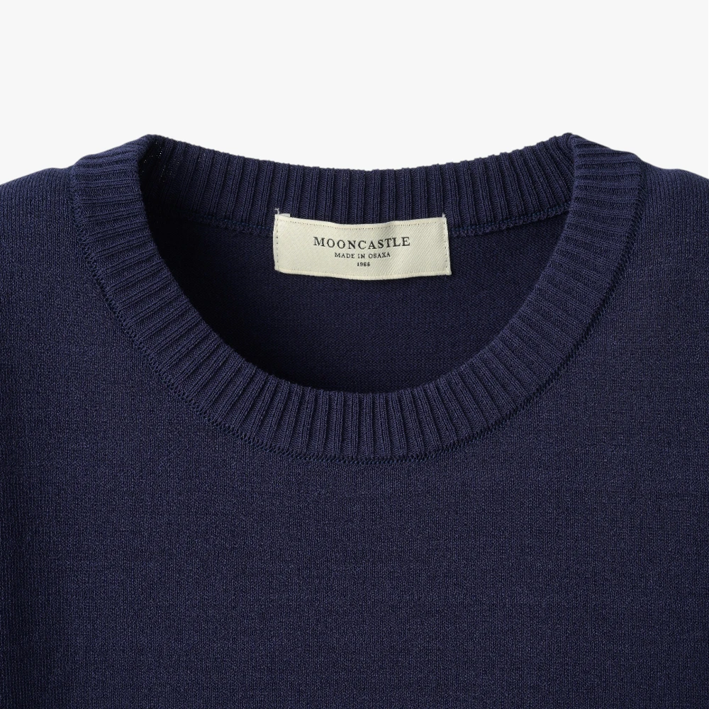 Close-up of the crew neck collar highlighting the ribbed knit construction and clean finishing.