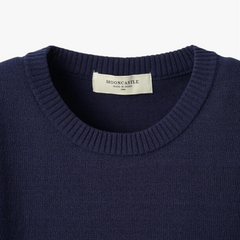 Close-up of the crew neck collar highlighting the ribbed knit construction and clean finishing.