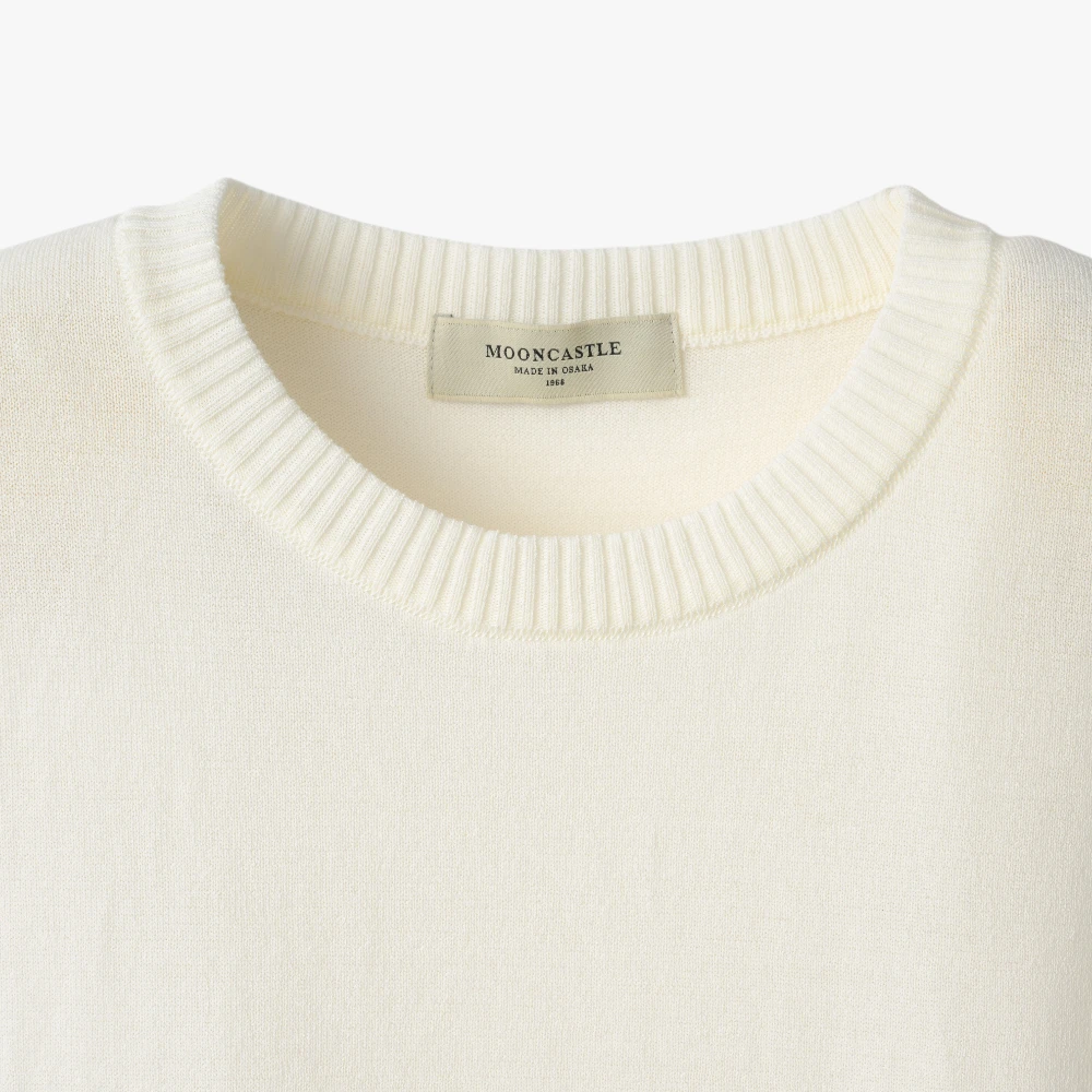 Close-up of the crew neck collar highlighting the ribbed knit construction and clean finishing.