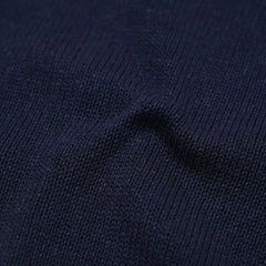 Close-up of the paper-silk blend knit showing its ultra-light texture, soft touch, and subtle navy sheen.