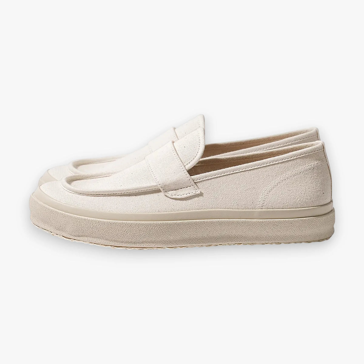 Side view of the Moonstar Loafy in natural featuring a minimalist slip-on loafer silhouette with vulcanized sole.
