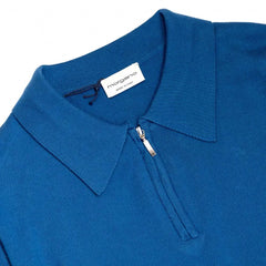 Back view of the Morgano zipped polo neck in blue chiaro showing the smooth knit structure and relaxed fit.