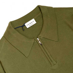 Close-up of the zip polo collar highlighting the metal zip and structured knit collar.