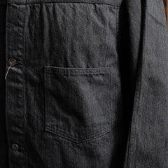 Close-up of the chest pocket showing stitching detail and panel construction.
