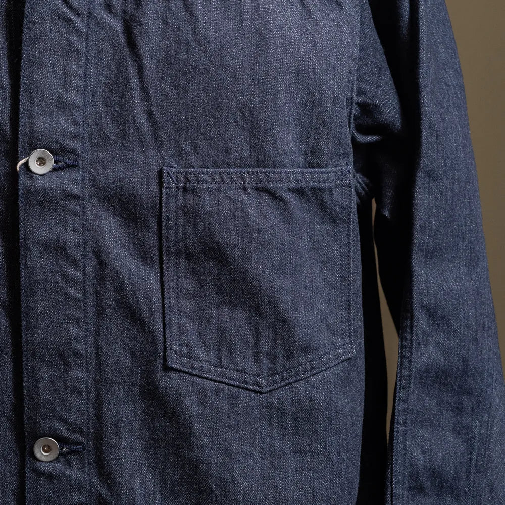 Close-up of the chest pocket showing stitching detail and denim texture.