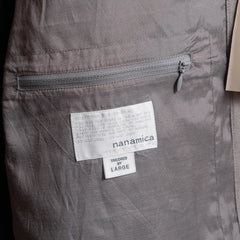 Close-up of the interior zip pocket showing functional storage and inner construction detail.