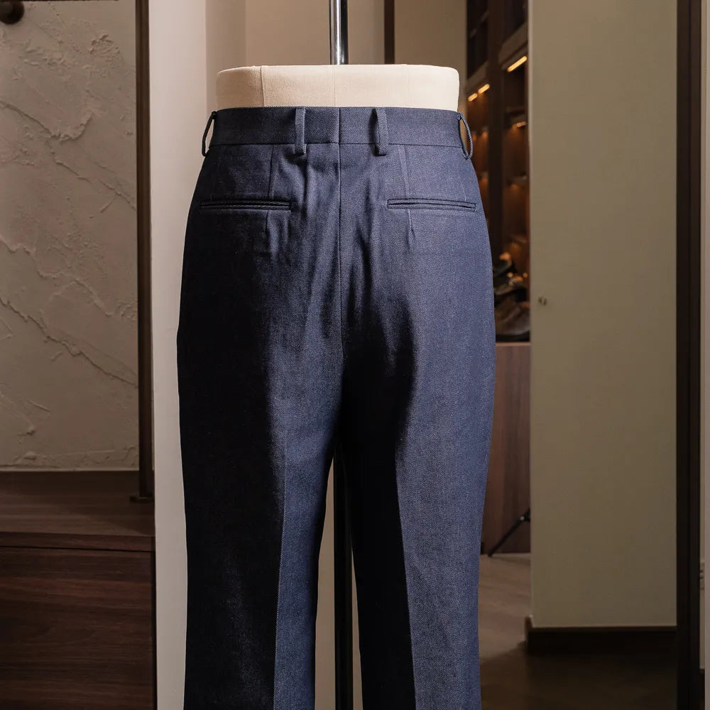 Back view highlighting back pockets and clean structured silhouette.