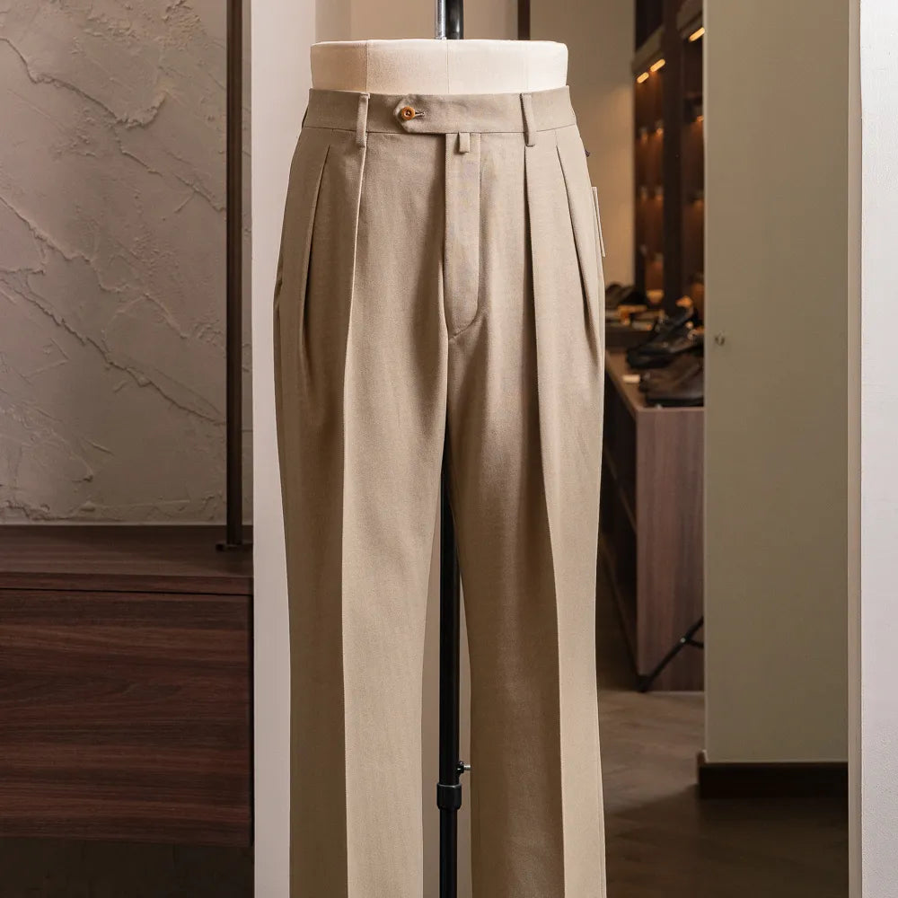 Front view of the Neat High Twisted Cotton Twill Standard trousers in beige showing wide leg silhouette and clean pleated front.
