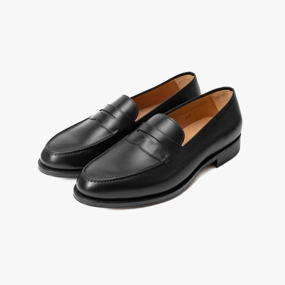 Oriental Albers Penny Loafer in black box calf leather, angled front view showing polished finish.