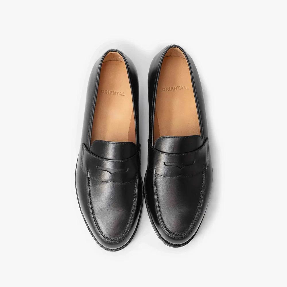 Oriental Albers Penny Loafer in black box calf leather, top view of pair with penny strap detail.