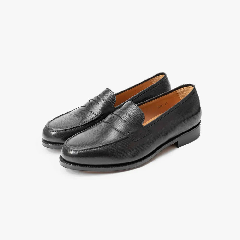 Oriental Albers Penny Loafer in Black Utah Calf leather, angled front view showing grain and strap.