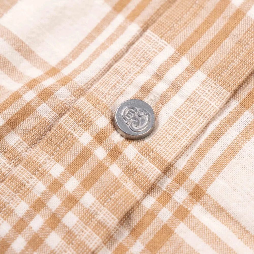 Close-up of the Madras fabric on the N5 Classic Shirt Beige showing the handwoven texture, color variation, and soft cotton feel.