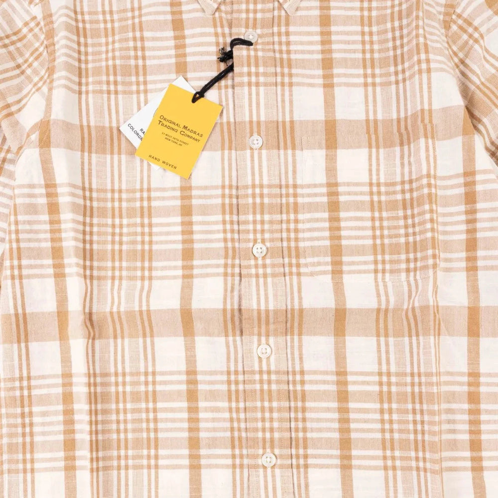 Close-up of the internal label on the Original Madras Trading Company N5 Shirt Beige showing branding and handwoven fabric tag.