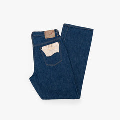 Half-fold view showing denim structure, weight, and silhouette shape.