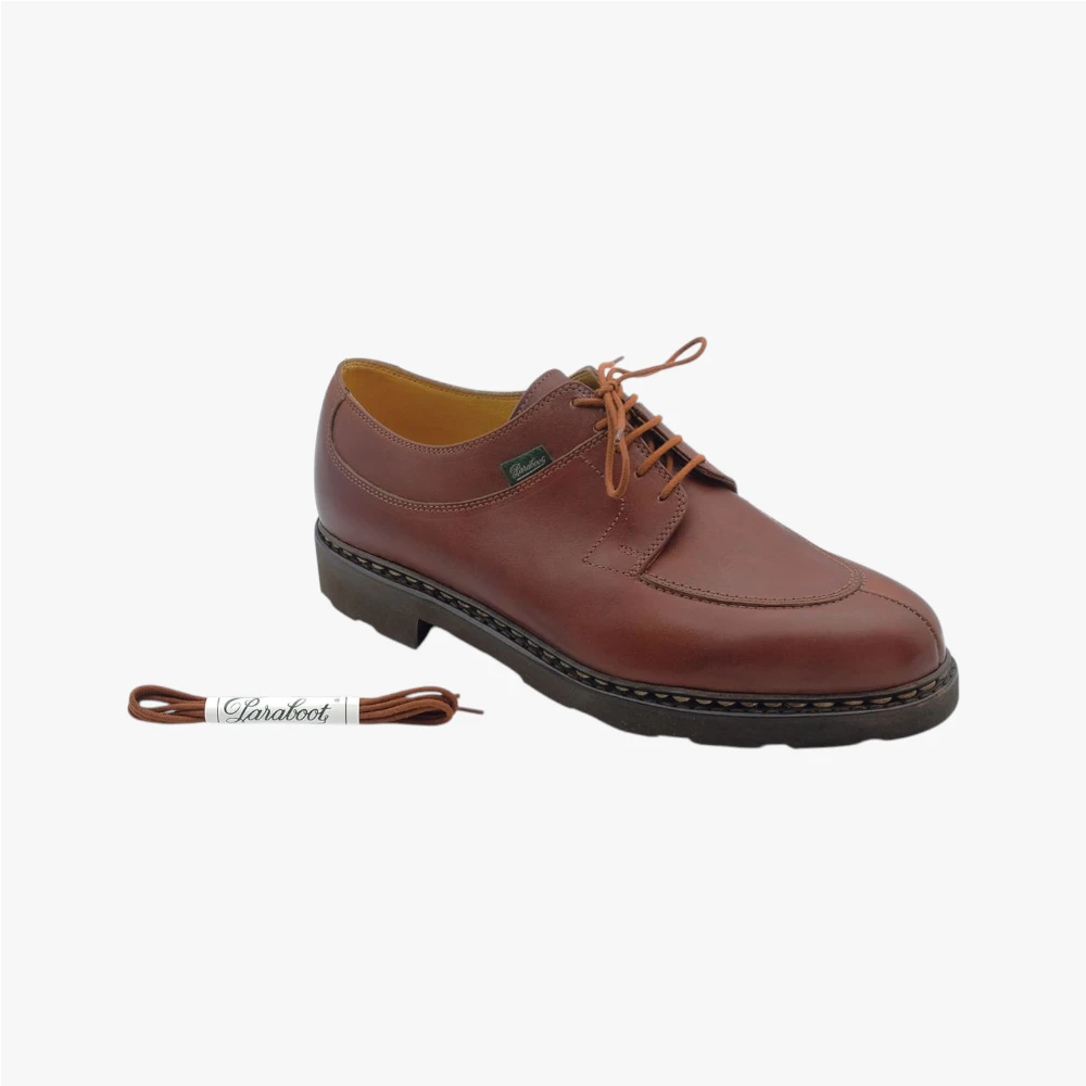 Close-up of the brown shoelace texture showing weave detail and durable construction.